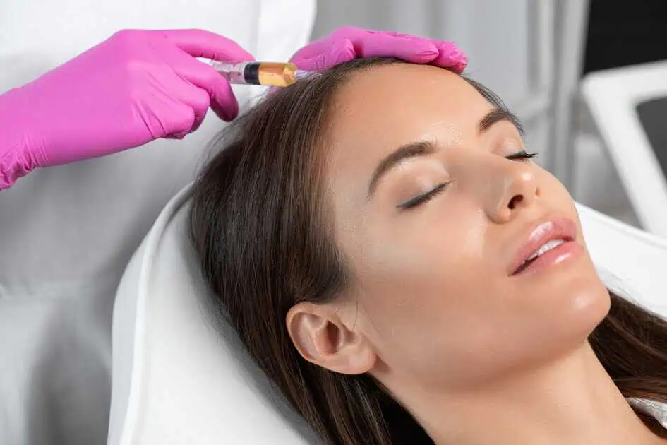 a woman receiving a botox injection